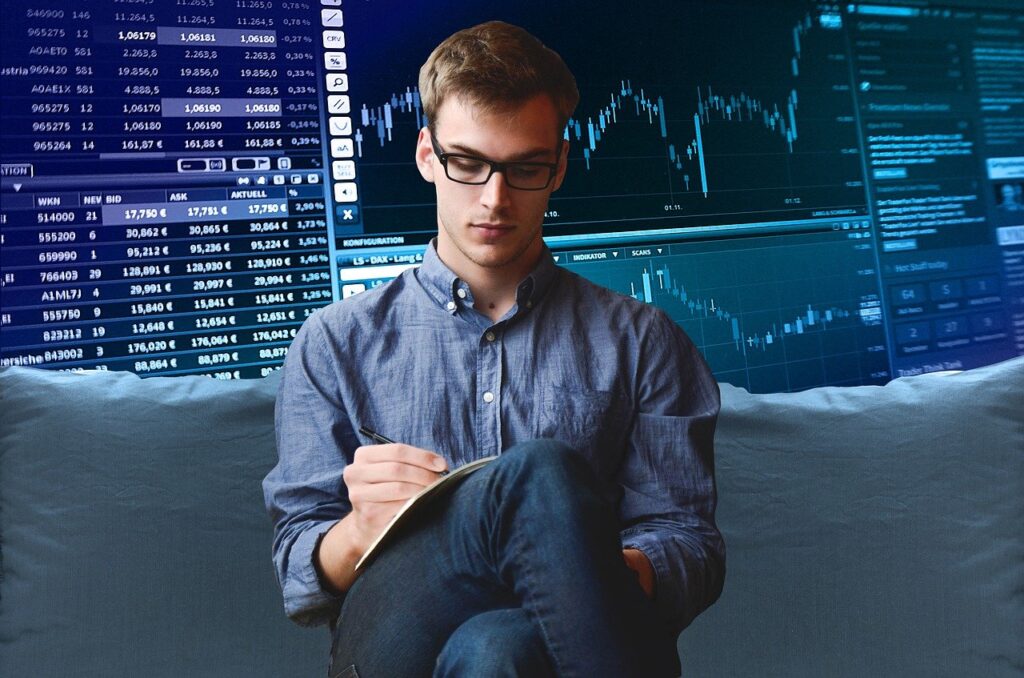 Entrepreneur analyzing charts on a digital device, symbolizing the importance of choosing a trusted trading application
